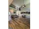 Spacious living room with hardwood floors, high ceilings, a loft, and comfortable seating area at 935 S Laney Rd, Locust Grove, GA 30248