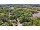 An aerial view of a neighborhood, showing many lush trees, neighboring lakes, and private yards at 210 Sweetwater Dr, Fayetteville, GA 30214
