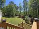 Large, lush backyard as seen from back deck at 210 Sweetwater Dr, Fayetteville, GA 30214