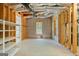 Unfinished basement with exposed beams, a window, and concrete flooring ready for customization at 210 Sweetwater Dr, Fayetteville, GA 30214