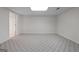 Unfurnished basement area with neutral carpet and a drop ceiling with recessed lighting at 210 Sweetwater Dr, Fayetteville, GA 30214