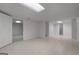 Finished basement with tile flooring and access to additional rooms and the basement bathroom at 210 Sweetwater Dr, Fayetteville, GA 30214
