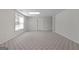 Spacious finished basement area with neutral colored carpet and a bright window at 210 Sweetwater Dr, Fayetteville, GA 30214