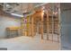 Unfinished basement area with exposed beams, concrete floors, and plumbed for the next owner at 210 Sweetwater Dr, Fayetteville, GA 30214