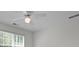 Bright and airy bedroom featuring a ceiling fan, window with blinds, and neutral color scheme at 210 Sweetwater Dr, Fayetteville, GA 30214
