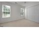 Bright bedroom with two windows offering natural light and a spacious closet for storage at 210 Sweetwater Dr, Fayetteville, GA 30214