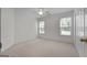 Cozy bedroom with carpet, natural lighting, and a double-door closet for storage at 210 Sweetwater Dr, Fayetteville, GA 30214