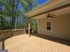 Wide angle view of deck, ceiling fan and view of trees at 210 Sweetwater Dr, Fayetteville, GA 30214
