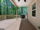 View of spacious back deck with grill overlooking the wooded backyard at 210 Sweetwater Dr, Fayetteville, GA 30214