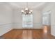 Traditional dining room with hardwood floors, modern lighting, and elegant trim work at 210 Sweetwater Dr, Fayetteville, GA 30214