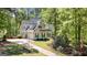 Beautiful home featuring dark shutters, an attached garage, and a well-manicured lawn at 210 Sweetwater Dr, Fayetteville, GA 30214
