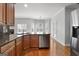 Bright kitchen area featuring stainless appliances, granite countertops, and ample natural light at 210 Sweetwater Dr, Fayetteville, GA 30214