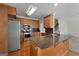 Well-equipped kitchen featuring stainless steel appliances and a granite-topped island with counter seating at 210 Sweetwater Dr, Fayetteville, GA 30214