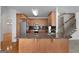 Kitchen featuring stainless steel appliances, a granite countertop island, and access to a staircase at 210 Sweetwater Dr, Fayetteville, GA 30214