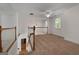 Open loft area with stairs and carpeted floor, perfect for a relaxing space at 210 Sweetwater Dr, Fayetteville, GA 30214