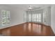 Spacious primary bedroom with wood floors, tray ceiling, and plantation shutters at 210 Sweetwater Dr, Fayetteville, GA 30214