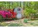 Storage shed with red and pink rhododendrons at 210 Sweetwater Dr, Fayetteville, GA 30214