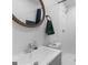 Modern bathroom featuring a wood-framed mirror, white subway tiles, and a sleek vanity with chrome fixtures at 2903 Monterey Dr, Decatur, GA 30032