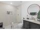 Bathroom featuring tiled walk-in shower, modern fixtures, and stylish vanity at 2903 Monterey Dr, Decatur, GA 30032