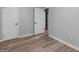 Bedroom featuring wood-look floors, neutral walls and access to an attached closet and hallway at 2903 Monterey Dr, Decatur, GA 30032