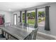 Bright dining room features wood-look floors and a rustic wood dining table with backyard views at 2903 Monterey Dr, Decatur, GA 30032