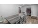 Dining room with wood-look floors, neutral paint, and a rustic wood dining table at 2903 Monterey Dr, Decatur, GA 30032