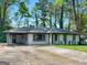 A charming home with a spacious driveway and a well-maintained front yard at 2903 Monterey Dr, Decatur, GA 30032