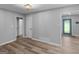 Bright living room with wood-look floors and access to an additional room at 2903 Monterey Dr, Decatur, GA 30032