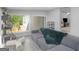 Bright living room with large windows and contemporary gray sofa at 2903 Monterey Dr, Decatur, GA 30032
