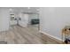 Open concept living room features wood-look floors, recessed lighting, and a view into the kitchen at 2903 Monterey Dr, Decatur, GA 30032