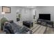 Stylish living room with sleek furniture, a large television, and plenty of natural light at 2903 Monterey Dr, Decatur, GA 30032