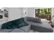 Cozy living room featuring a grey sofa and views of the side and back yards at 2903 Monterey Dr, Decatur, GA 30032