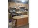 Functional kitchen featuring stainless steel appliances, light cabinetry and a breakfast bar at 6183 Field Stone Dr, Douglasville, GA 30134
