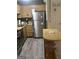 Compact kitchen with stainless steel appliances, light wood cabinets and a functional layout at 6183 Field Stone Dr, Douglasville, GA 30134