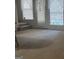 Inviting living room with natural light, white trim and access to outside area at 6183 Field Stone Dr, Douglasville, GA 30134