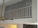 Open loft area featuring white railing, unique architectural details and a ceiling fan at 6183 Field Stone Dr, Douglasville, GA 30134