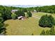 Spacious lot with mature trees, a large shed, and well maintained lawn at 2060 Dixie Rd, Covington, GA 30014