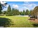 Large, well-maintained backyard featuring a pool and mature landscaping for privacy and beauty at 2060 Dixie Rd, Covington, GA 30014