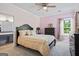 Bedroom with a gold and pink color scheme at 2060 Dixie Rd, Covington, GA 30014