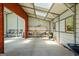 The barn interior features a workstation, storage, and windows for natural light at 2060 Dixie Rd, Covington, GA 30014
