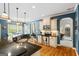 Bright kitchen showcasing granite countertops, wooden floors, stainless steel appliances, and blue accent walls at 2060 Dixie Rd, Covington, GA 30014