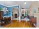 Interior view showcasing an open-concept dining and living area with hardwood floors and a fireplace at 2060 Dixie Rd, Covington, GA 30014