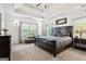 Spacious main bedroom with trey ceilings, large windows, and dark wood furniture at 2060 Dixie Rd, Covington, GA 30014