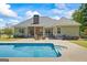 Spacious backyard with an in-ground pool, outdoor seating, and a built-in grill area for summer barbecues at 2060 Dixie Rd, Covington, GA 30014