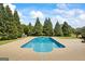 Beautiful backyard with a sparkling in-ground pool and a spacious patio area, perfect for outdoor activities at 2060 Dixie Rd, Covington, GA 30014