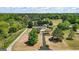 Aerial view of the home showing long driveway, mature trees, and lush landscaping at 424 N Green Cir, Mcdonough, GA 30252