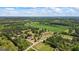 Birds-eye view of the property, displaying lush surroundings, and mature trees at 424 N Green Cir, Mcdonough, GA 30252