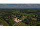 An aerial view showcases the property's perimeter and its surrounding landscape and trees at 424 N Green Cir, Mcdonough, GA 30252