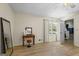 Bedroom featuring wood floors, a vanity, and a window offering a blend of comfort and functionality at 424 N Green Cir, Mcdonough, GA 30252
