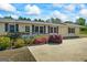 Charming home with colorful landscaping, a cozy porch, and a spacious driveway at 424 N Green Cir, Mcdonough, GA 30252